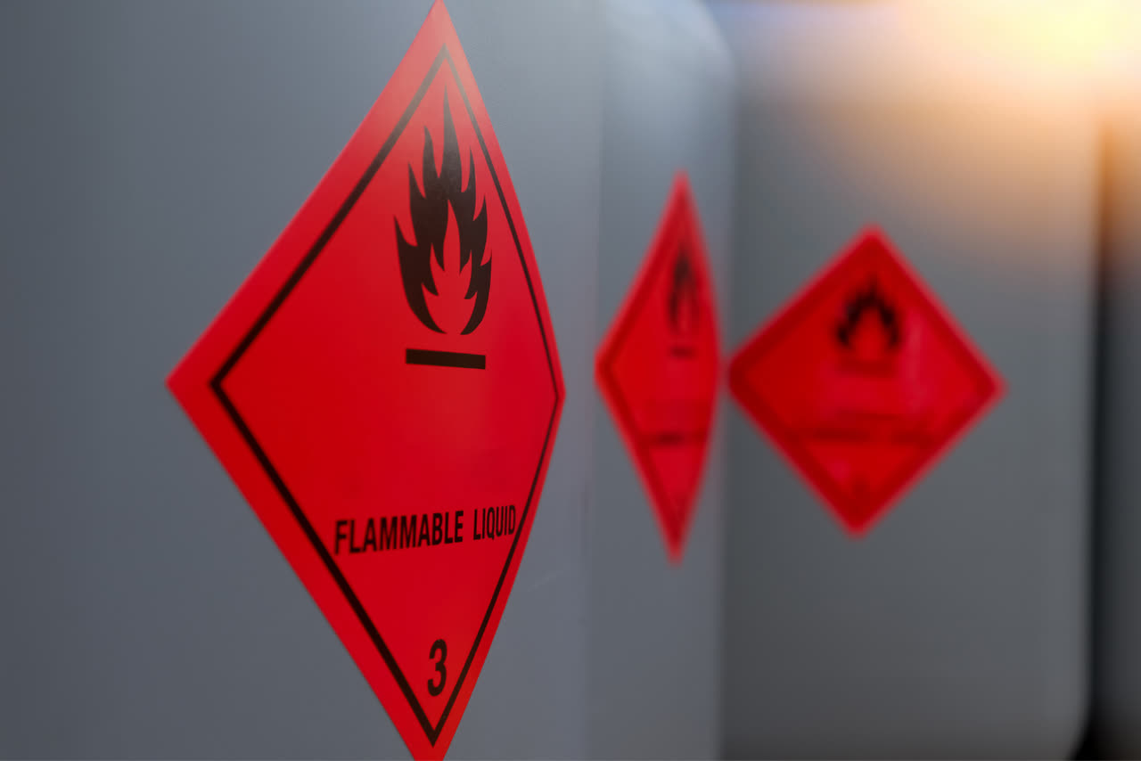 Red diamond FLAMMABLE dangerous goods hazard placard mounted on a freight trailer