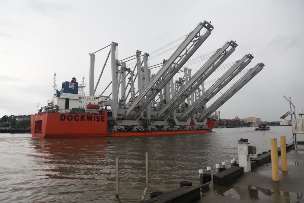 Heavy-lift vessel transporting four ship-to-shore container cranes as breakbulk project cargo